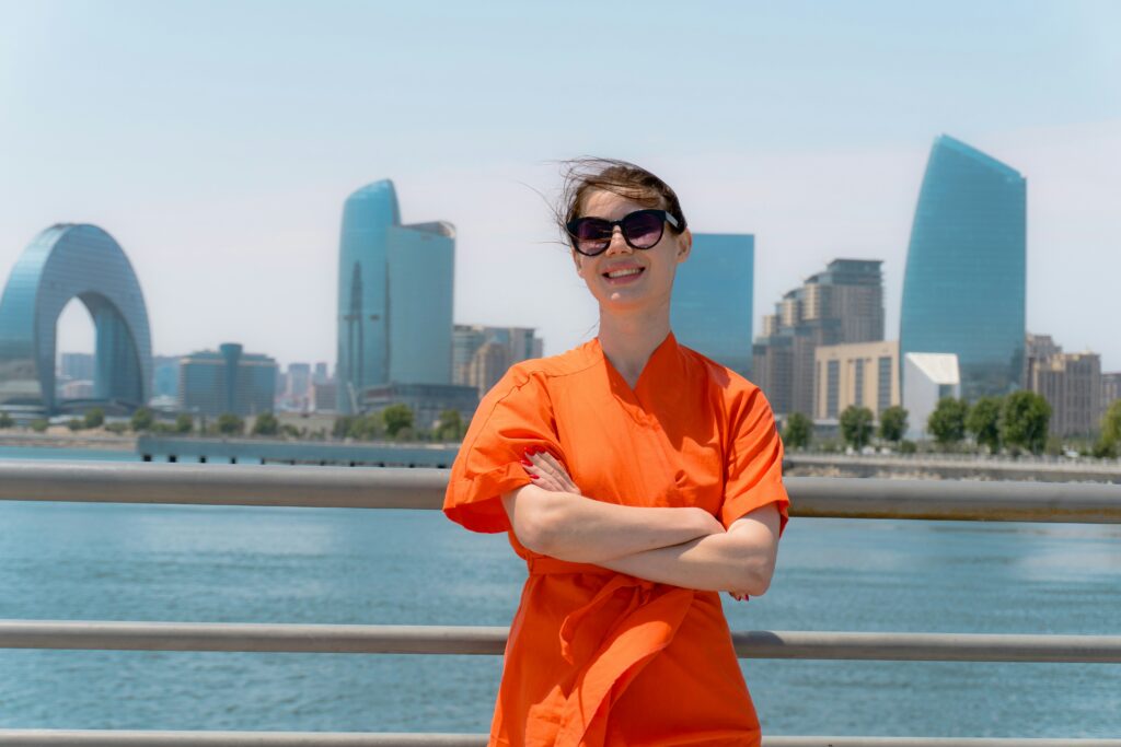 Woman smiling behind City Skyline